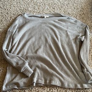 Grey long sleeve top with buttons on shoulder